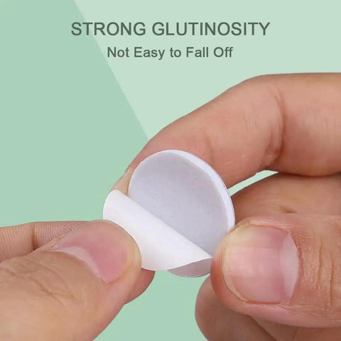 Close-up of a hand peeling adhesive backing, highlighting strong adhesion for 16 Piece Self Adhesive Caster Wheels For Kitchen Appliances.
