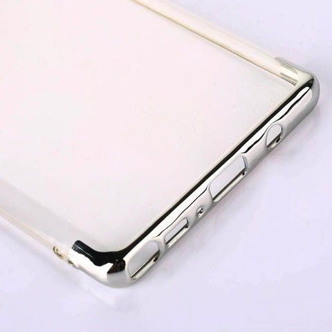 Close-up of a shiny metallic phone case with button cutouts, corner view.