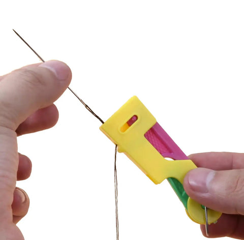 Person using 3 Pack Automatic Needle Threaders For Sewing Machines Easy No Fuss Threading Tool Durable Plastic Colors Vary Green Yellow Red.