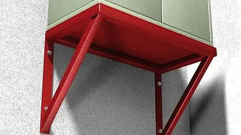A red metal bracket support structure mounted on a concrete wall, used for securing shelves or units with strong anchoring.