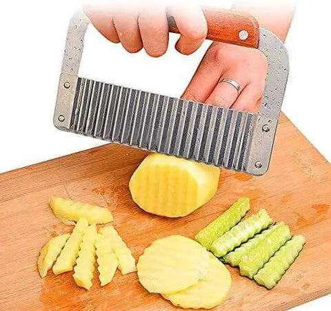 Crinkle Fry Cutter Knife With Stainless Steel Blade And Wooden Handle for French fries and veggies being used on boiled potatoes.