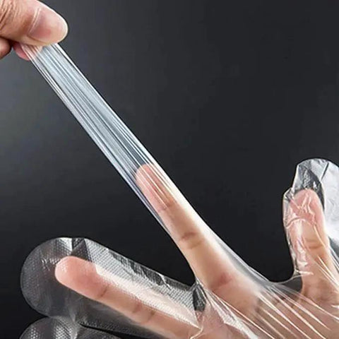 Clear Plastic Disposable Gloves For Food Prep And Service Bulk 6000 Pcs, stretching transparent HDPE material showing durability