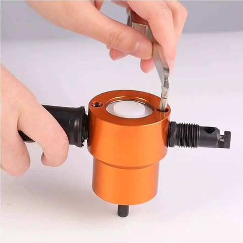 Person using wrench on Pro Grade Double Head Sheet Metal Nibbler Drill Attachment 360 Degree Adjustable Drill Tool for precise metal cutting.