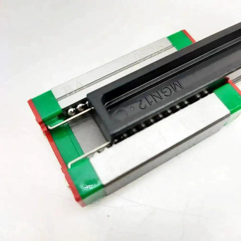 Close-up of Compact MGN12H Linear Block Carriage With Guide Rail for CNC Machines, featuring square bearing blocks, four-point contact