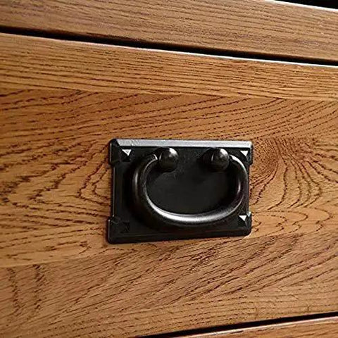 Antique Black Ring Pull Handles Set Of 4 For Dresser Cabinets Doors And Furniture Drawers close-up on wooden drawer