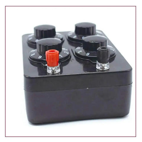 Front view of black resistance box with four top knobs and red/black terminals.