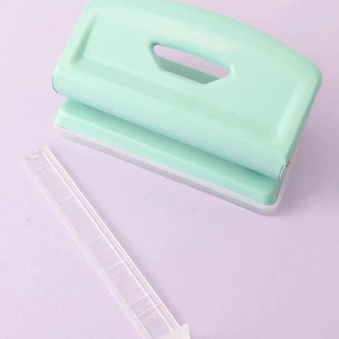 Mint 2 Hole Puncher With Waste Tray, 10 Sheet Capacity, Metal Puncher With Adjustable Guide on purple background