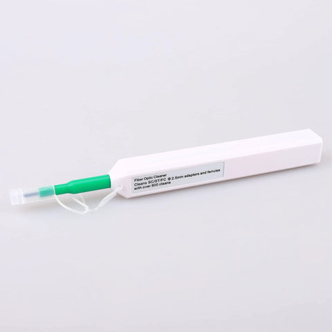 Fiber optic cleaner pen with green grip and clear cap beside white rectangular box packaging