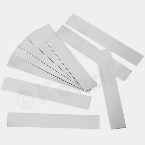 10 Piece Stainless Steel Shim Stock Set With 1 Inch Width And 6 Inch Length, 0.01 Inch Thick, metal shim shims arranged flat on surface.