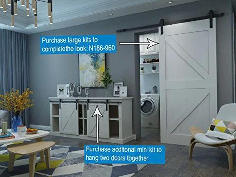 Mini Rustic Sliding Barn Door Hardware Kit In Oil Rubbed Bronze For Cabinets Bookshelves Vanities TV Consoles And More With Fully Included Mounting Hardware For Easy Install 48 Inch Track installed on a cabinet in a living room setting.