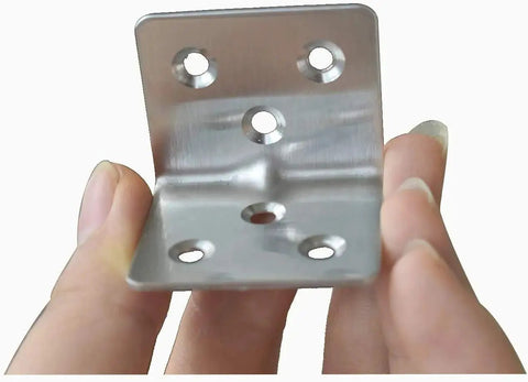 Close-up of a stainless steel corner brace showing 3 mounting holes for wood furniture support, 40 pack, 90 degree L shaped bracket.