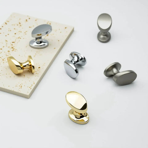4 Pack Polished Brass Cabinet Knobs Set Solid Zinc Alloy Pulls on display with silver knobs for kitchen and bathroom furniture.