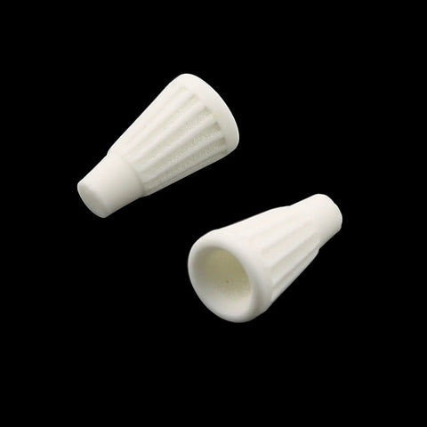 Close-up of two white ceramic wire connector caps, 19x10mm, screw-type, heat-resistant terminal caps.