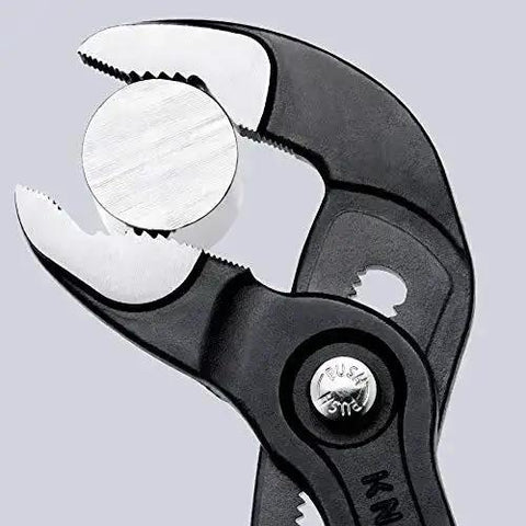 Cobra Water Pump Pliers 7 And A Quarter Inch Beefy Self Locking Pliers gripping metal pipe close-up