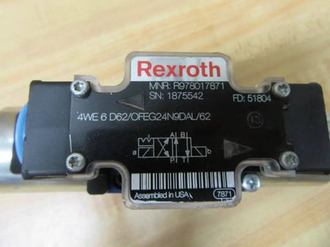 Close-up of a hydraulic directional control valve 4WE 6 D62/OFEG24N9D K25L/62 PN R978017871 with label and connector view