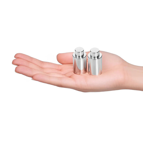 Two metal pins in a hand, part of 10 Pack Welding Table Fixture Pins For Quick Alignment And Rock Solid Setup 0.629 In X 1 In X 1.5 In Clamp Pins Stop Alignment Squares Easy Fixturing Kit For Precise Welds And Fast Positioning