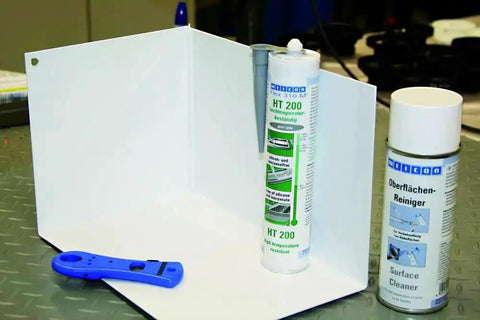 Flex 310 M HT 200 Go To High Temp HVAC Adhesive And Sealant For Ducts And Metal 10.5 Oz Cartridge and cleaner on table