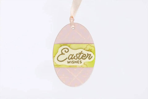 Pastel pink oval Easter egg card with 'Easter Wishes' label, created using 3 Inch Oval Easter Egg Lever Action Punch For Paper Crafting And Scrapbooking.