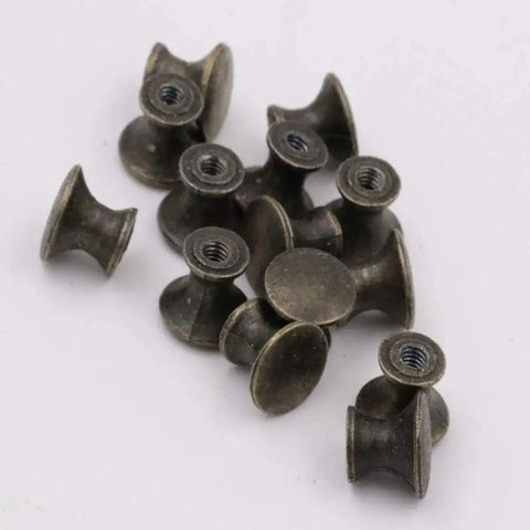 10 Pcs Vintage Bronze Drawer Pull Handles Zinc Alloy Mini Metal Knobs for cabinets, jewelry boxes, and gift cases in a pile