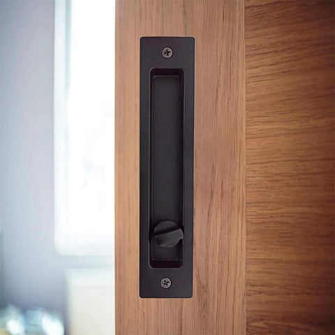 Hidden Pocket Door Lock Hardware With Keys, Recessed Matte Black Door Handle For Sliding Pocket Doors, shown installed on wood door