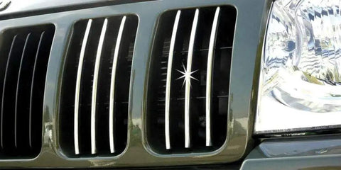 Close-up of vehicle front grille with Enhanced 18ft Chrome U Channel Edge Guard Trim For Door Edges And Bumpers installed.