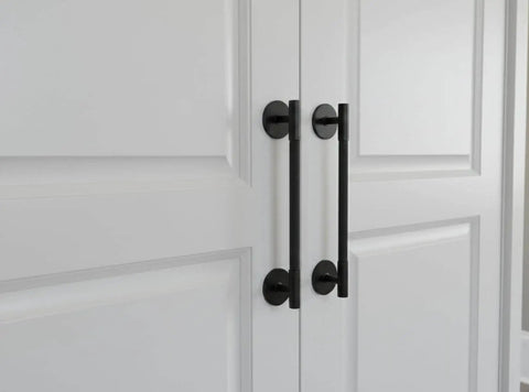 Matte Black Escutcheon Back Plates For Cabinet Knobs And Doors Four Pack Round Rosette Plate Two And One Third Inch Heavy Duty Die Cast Zinc Ideal For Bifold Closet Doors Door Pulls And Handles shown installed on white bifold doors