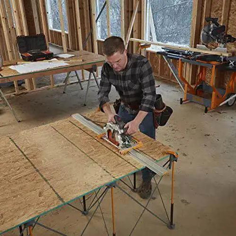 Man using 100 Inch Clamp Edge Saw Guide For Straight Cuts Aluminum Track Rail With Dual T Tracks 50 Inch Clamp Edge Plus 50 Inch Extension Pro Grade Setup Saver For Plywood And Large Sheet Materials on a wooden board in workshop.