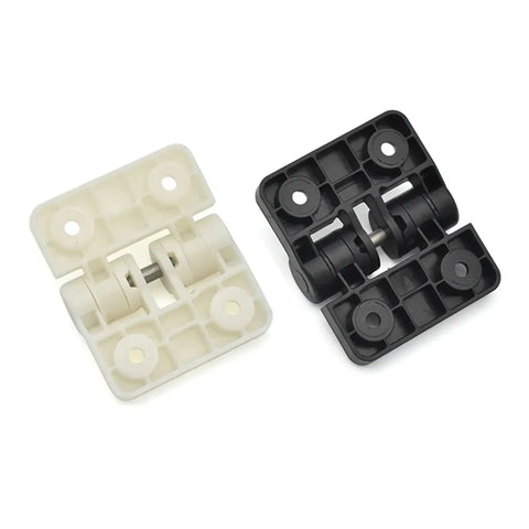 Front view of two XK551 resin positioning hinges, white and black plastic blocks with metal pins.
