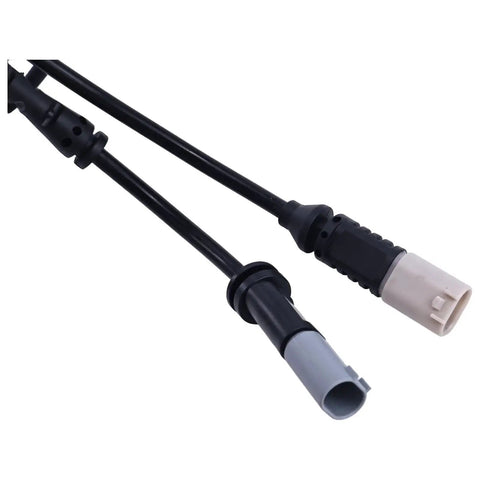 Two brake pad wear sensor cables with black insulation and beige/gray connectors; BMW-compatible close-up