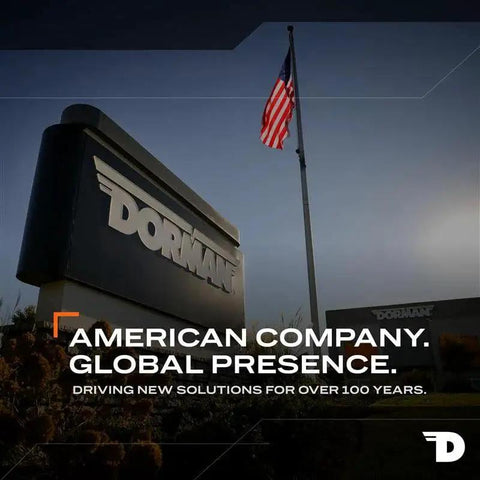 Dorman company sign with American flag, text 'American Company. Global Presence. Driving New Solutions for Over 100 Years.'