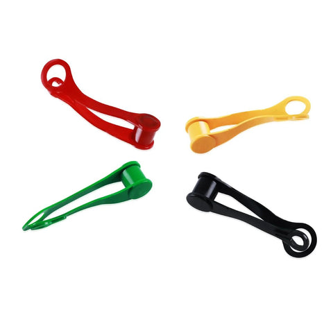 Set of four plastic hydraulic port plug covers in red, yellow, green, and black with circular end caps.