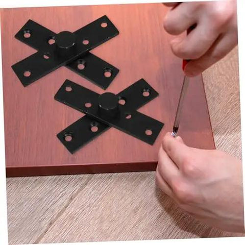 Person installing Secret Swivel Stainless Steel Exterior Door Hinge For Cabinets And Toilet Doors Hidden Door Hinge on wooden surface