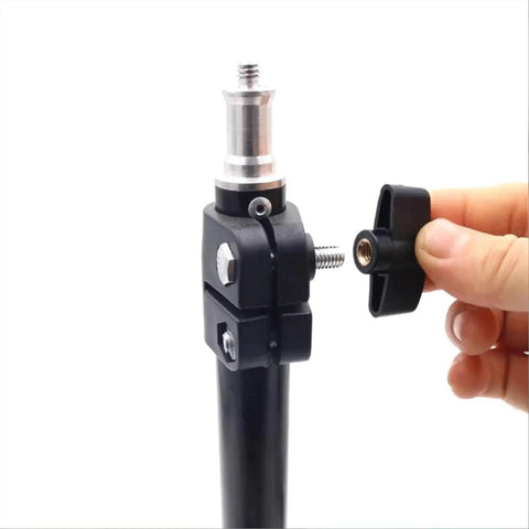 Close-up of hand tightening a 10 Pack Through Hole T Knobs 1/4-20 for T Track Jigs and Featherboards on a black stand.