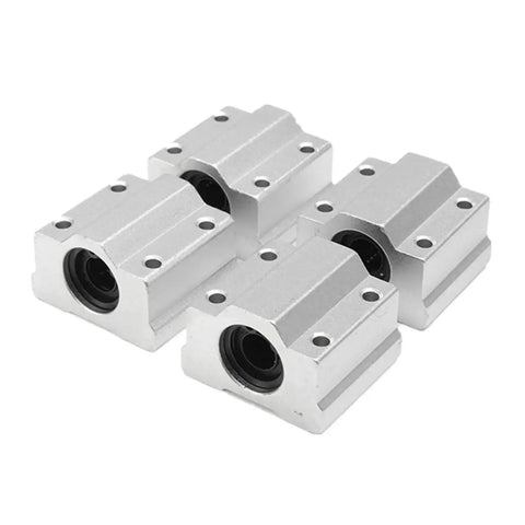 Four silver SC8UU ball bearing slides from the 8x200mm Linear Rail Shaft Kit 2Pcs With 4 Guide Supports And 4 SC8UU Ball Bearing Slides