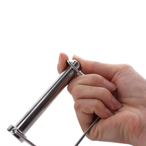 Hand holding Two Pack Large Safety Coupler Pin Half Inch Diameter Three Point Five Four Inch Length Marine Grade 316 Stainless Steel