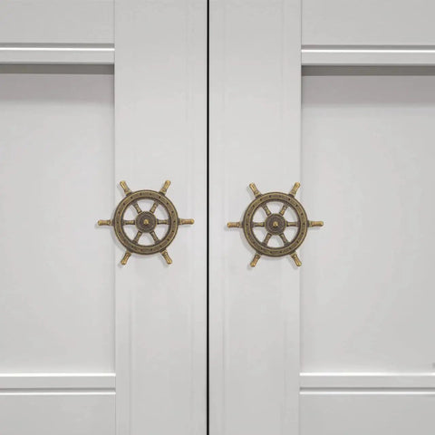 Two doors with Vintage Ship Wheel Anchor Cabinet Pulls Set Of 4 For Dressers And Wardrobes Nautical Style Decorative Handles installed.