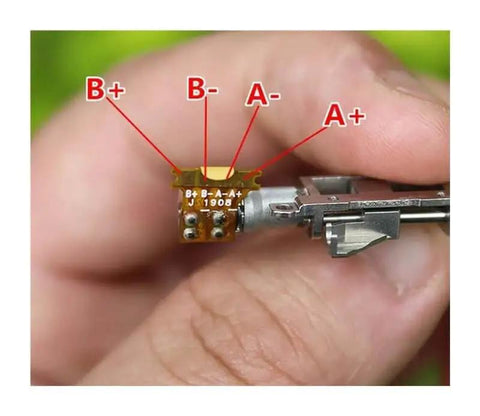 Close-up of a 5mm Planetary Gearbox For Stepper Motor With Precision Ball Bearing And Linear Slider Block, showing wire connections.