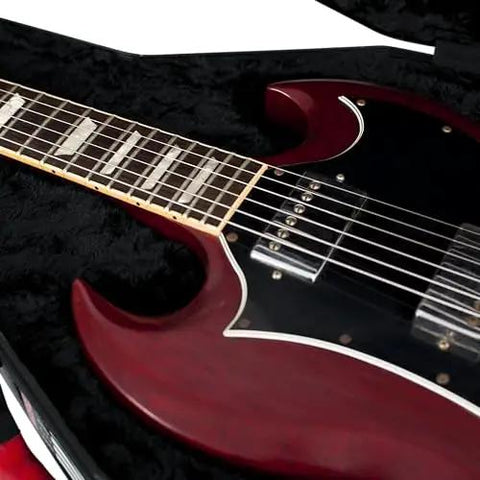 Close-up of an SG style double cutaway guitar in a molded flight case with plush interior and TSA approved locking latch.