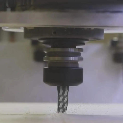 Close-up of an O Flute CNC Router Bit in use, single flute end mill attached to a CNC machine for engraving and milling.
