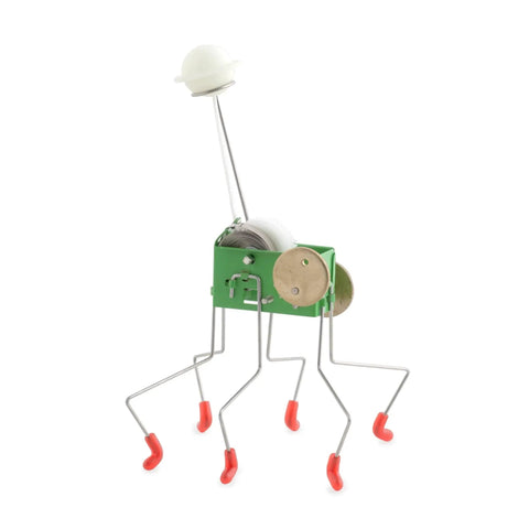 Wind Up Office Desk Pet Toy For Home And Work Cute Dancing Companion That Walks Across The Table seen with metal legs and green body