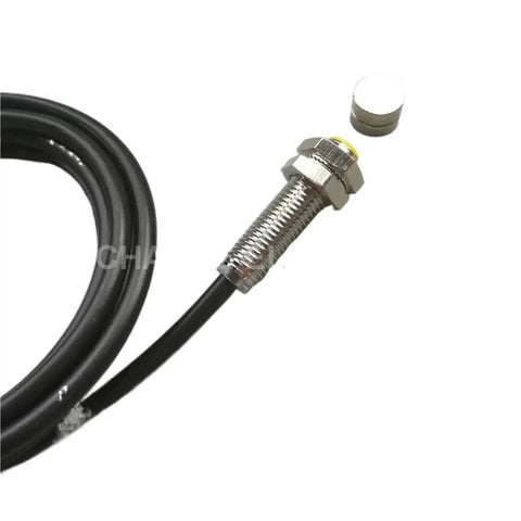 Front view of M8 permanent magnet switch, normally open, 10 mm sensing distance, metal threaded body with black cable.