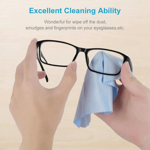 Using a blue microfiber cloth to clean glasses, showcasing Eight Pack Microfiber Cleaning Cloths for Glasses and Screens 6x7 Inches.