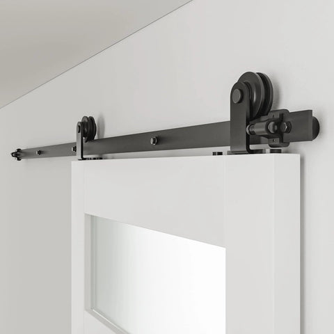 6 Ft Sliding Barn Door Hardware Kit With Heavy Duty Track System installed on a white door with rollers and spliced rails