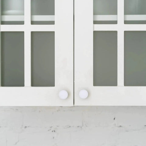 Front view of cabinets with Four Sizes White Plastic Hole Plugs For Cabinet And Furniture Round End Caps For Screw Holes installed