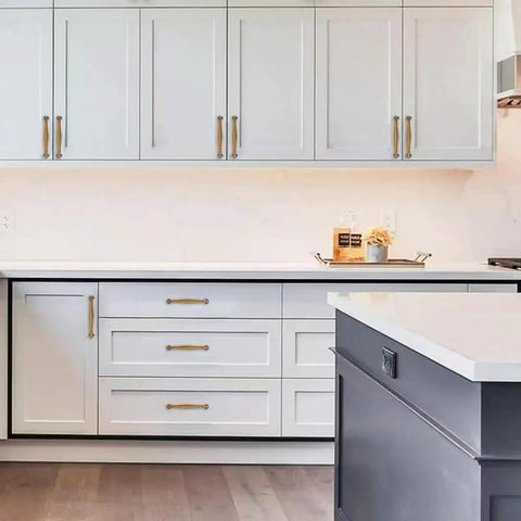 Modern kitchen with 10 Pack Antique Brass Cabinet Pulls 3 Inch Center To Center Vintage Solid Hardware installed on white cupboards.