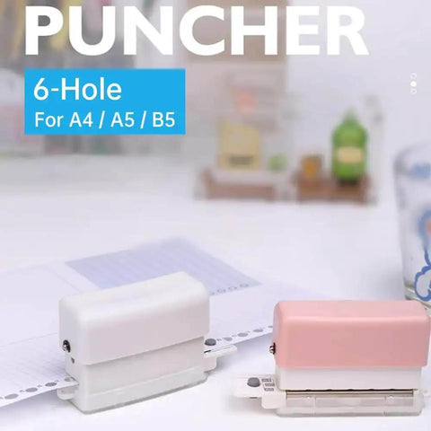Six Hole Round Paper Punch Handheld Circle Punch For A4 A5 B5 Notebooks Scrapbooks And Planners, pocket size, shown in white and pink.