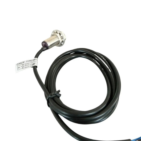 Angled front view of M12 magnetic proximity switch with cable, normally open, 10 mm sensing distance
