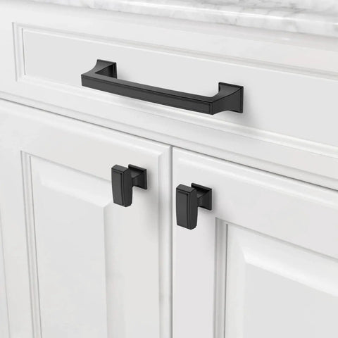Close-up of a cabinet with an installed 5 inch matte black kitchen cabinet handle from the 10 pack collection, enhancing modern decor.