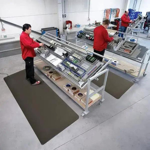 Workers using Conductive Grid Tape For EMI Shielding And ESD Protection in electronics manufacturing