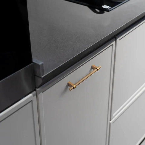 Installation of Six Pack 5 Inch Center To Center Knurled Antique Brass Cabinet Bar Handles with Blocky Triangular Mounts on kitchen drawer